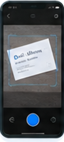 CardFlow app camera viewfinder scanning a physical business card on a desk.